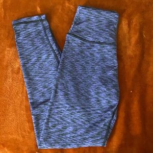 Black/purple striped fitness leggings.